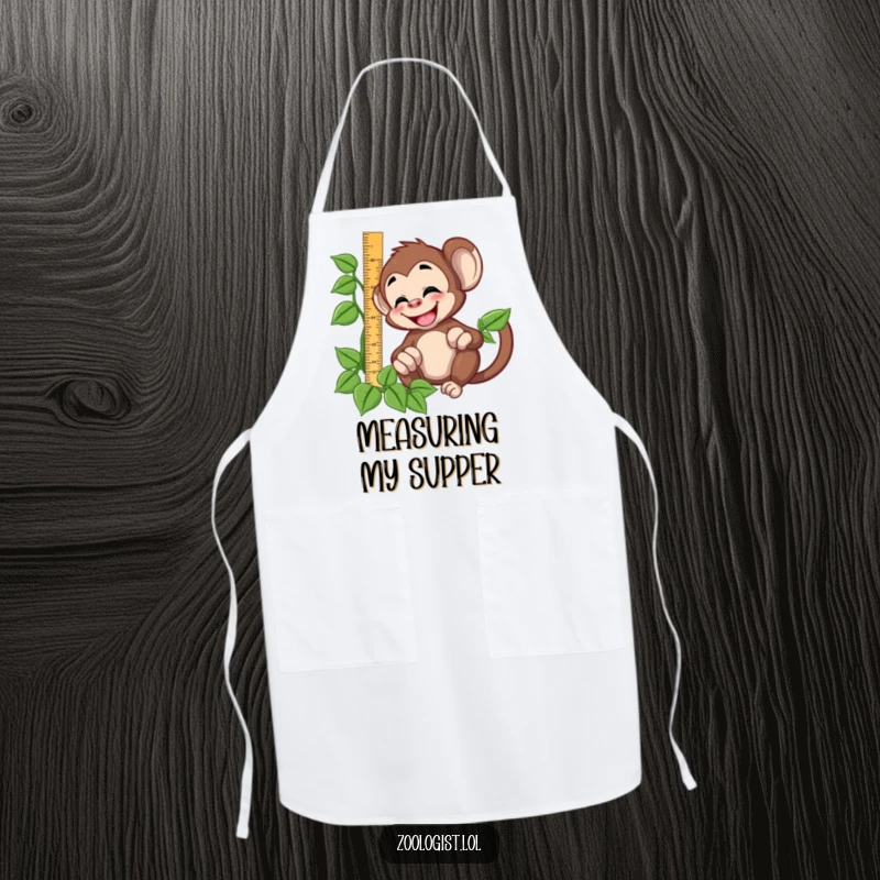 Funny giggling monkey character trying to measure a vine with a ruler, on a protective apron for chefs and crafters.