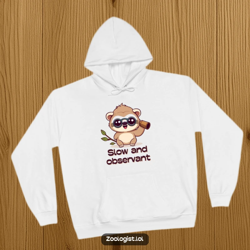 Funny happy Kawaii sloth zoologist character wearing binoculars, looking amazed, cozy hoodie for nature lovers, funny gift.