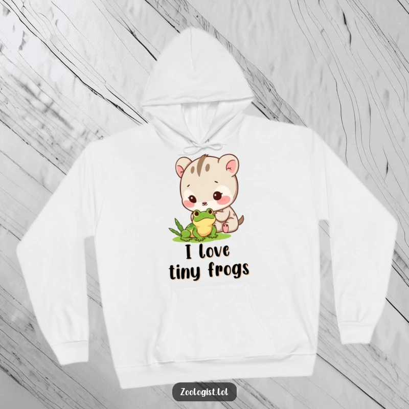 Funny Hoodie: A kawaii animal character carefully observing a tiny frog with a look of gentle excitement and fascination.