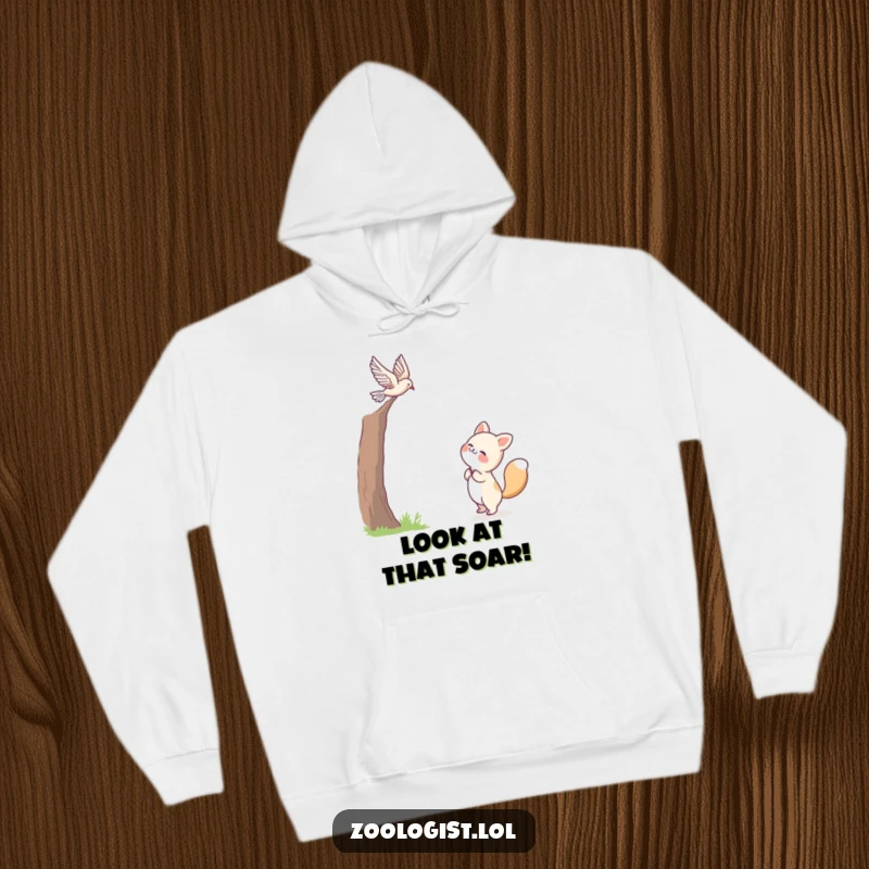 Funny hoodie depicting a cute animal character joyfully watching a bird in mid-flight, exuding happiness and a sense of wonder.